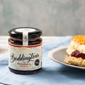 Close-up of a Boddington's Berries Strawberry Conserve jar, highlighting the handwritten-style label and traditional packaging.